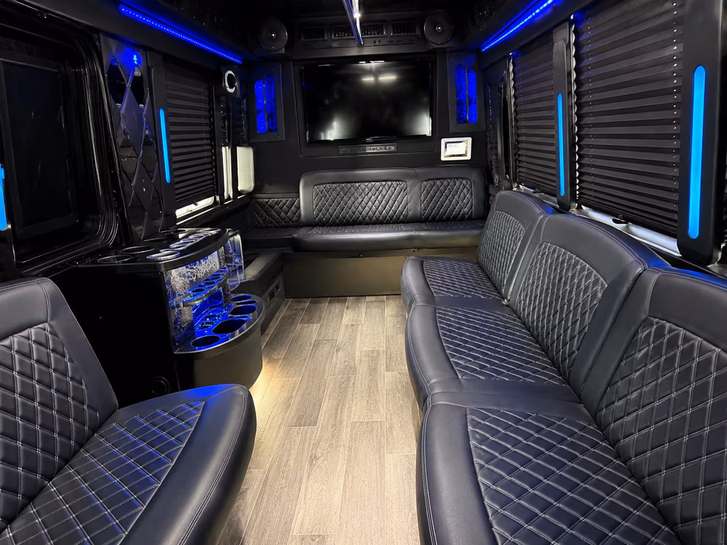 Wedding guests seated inside a party bus serving Salem